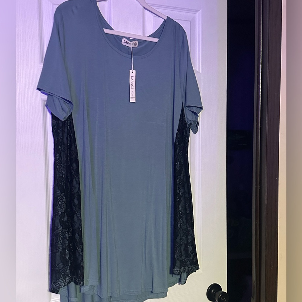 Blue larace shirt with black design on the side. 4x